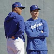 Shohei Ohtani of the Los Angeles Dodgers (R) chats with manager Dave Roberts during spring training in Glendale, Arizona, on Feb. 11, 2024. (Kyodo) ==Kyodo