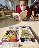 A child reads a Chinese version of the Japanese manga "Dragon Ball" in a library in Beijing on March 8, 2024. The manga series is the best known work of Akira Toriyama, a monumental figure in the Japanese manga and anime world, who died of an acute subdural hematoma on March 1, aged 68. (Kyodo) ==Kyodo