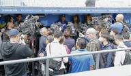 Los Angeles Dodgers manager Dave Roberts (back, facing camera) speaks to reporters before a spring training game against the Los Angeles Angels in Los Angeles on March 24, 2024. (Kyodo) ==Kyodo
