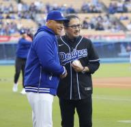 Japanese actor Hiroyuki Sanada (R) shakes hands with Los Angeles Dodgers manager Dave Roberts after throwing the ceremonial first pitch before a baseball game against the St. Louis Cardinals in Los Angeles on March 31, 2024. (Kyodo) ==Kyodo