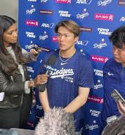 Los Angeles Dodgers pitcher Yoshinobu Yamamoto speaks to reporters after picking up his second win of the season in a baseball game against the Washington Nationals on April 25, 2024, at Nationals Park in Washington. (Kyodo) ==Kyodo