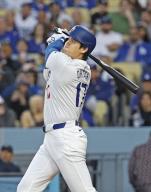 Los Angeles Dodgers designated hitter Shohei Ohtani hits a two-run home run in the first inning of a baseball game against the Miami Marlins at Dodger Stadium in Los Angeles on May 6, 2024. (Kyodo) ==Kyodo