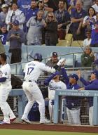 Los Angeles Dodgers designated hitter Shohei Ohtani (17) is greeted by manager Dave Roberts (2nd from R) after hitting a two-run home run in the first inning of a baseball game against the Miami Marlins at Dodger Stadium in Los Angeles on May 6, 2024. (Kyodo) ==Kyodo