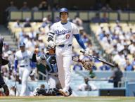 Shohei Ohtani of the Los Angeles Dodgers leaves the batter