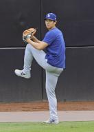 Shohei Ohtani of the Los Angeles Dodgers plays catch before a baseball game against the San Diego Padres on May 10, 2024, in San Diego, California. (Kyodo) ==Kyodo