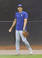 Shohei Ohtani of the Los Angeles Dodgers smiles while playing catch before a baseball game against the San Diego Padres on May 10, 2024, in San Diego, California. (Kyodo) ==Kyodo