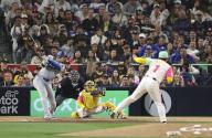 Shohei Ohtani of the Los Angeles Dodgers hits a double off compatriot Yuki Matsui in the eighth inning of a baseball game against the San Diego Padres on May 10, 2024, at Petco Park in San Diego, California. (Kyodo) ==Kyodo