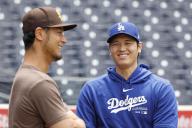 Shohei Ohtani (R) of the Los Angeles Dodgers chats with Yu Darvish of the San Diego Padres before a baseball game on May 11, 2024, at Petco Park in San Diego, California. (Kyodo) ==Kyodo