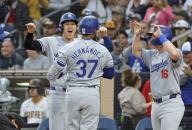 Teoscar Hernandez (37) of the Los Angeles Dodgers is greeted by Shohei Ohtani (back, L) after hitting a grand slam in the sixth inning of a baseball game against the San Diego Padres on May 11, 2024, at Petco Park in San Diego, California. (Kyodo) ==Kyodo