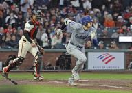 Shohei Ohtani (L) of the Los Angeles Dodgers runs to first base after hitting an RBI single in the fifth inning of a baseball game against the San Francisco Giants at Oracle Park in San Francisco on May 13, 2024. (Kyodo) ==Kyodo