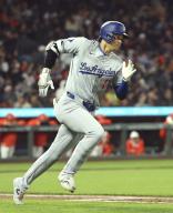 Los Angeles Dodgers designated hitter Shohei Ohtani runs toward first base after hitting an RBI double in the seventh inning of a baseball game against the San Francisco Giants at Oracle Park in San Francisco on May 14, 2024. (Kyodo) ==Kyodo