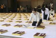 Officials in Nagasaki on May 17, 2024, turn the pages of some of the 200 books listing the names of 195,704 victims of the 1945 U.S. atomic bombing of the southwestern Japan city. The airing at the Nagasaki National Peace Memorial Hall for the Atomic Bomb Victims is held every year prior to the rainy season. (Kyodo) ==Kyodo