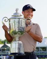 Xander Schauffele of the United States holds the victor