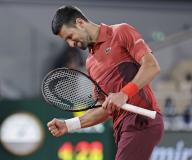 Novak Djokovic of Serbia reacts after earning a point against Lorenzo Musetti of Italy in a men