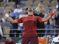 Novak Djokovic of Serbia celebrates after defeating Lorenzo Musetti of Italy in a men