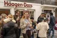 People line up for free scoops of Hagen-Dazs ice cream celebrating the reopening of their store in Brooklyn Heights in New York on Saturday, April 27, 2024.The store is the first store opened by the ice cream company, in 1976. Hagen-Dazs is a brand of General Mills. ( Richard B. Levine