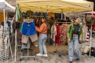 Shoppers browse second-hand merchandise at a flea market in the neighborhood of Dumbo in Brooklyn in New York on Saturday, April 27, 2024. ( Richard B. Levine