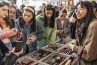 Gen Z women shop for older point-and-shoot digital cameras at a flea market in the neighborhood of Dumbo in Brooklyn in New York on Saturday, April 27, 2024. ( Richard B. Levine