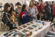 Gen Z women shop for older point-and-shoot digital cameras at a flea market in the neighborhood of Dumbo in Brooklyn in New York on Saturday, April 27, 2024. ( Richard B. Levine