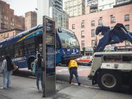A worker prepares to tow a disabled NYCTA bus in Chelsea in New York on Monday, May 6, 2024. (Â Richard B. Levine