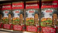 Cans of Partanna brand Italian extra virgin olive oil are seen on a supermarket shelf in New York on Thursday, May 9, 2024. (Â Richard B. Levine
