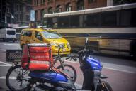 Scooter with DoorDash branded tote parked in the Flatiron neighborhood of New York on Monday, May 13, 2024. (Â Richard B. Levine