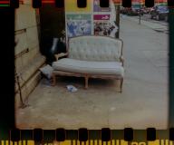 Abandoned couch in the trash outside of a building in the NoMad neighborhood of New York in March 2024. ( Richard B. Levine) Photographed on film with an instamatic camera