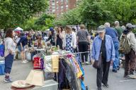 Shoppers search for bargains at the humongous annual Penn South Flea Market in the New York neighborhood of Chelsea on Saturday, May 18, 2024. The flea market appears like Brigadoon, only once every year, and the residents of the 20 building Penn South cooperative have a closet cleaning extravaganza. Shoppers from around the city come to the flea market which attracts thousands of visitors. (Â Richard B. Levine