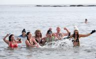 Sarah Goldsborough celebrates 366 days of consecutive cold water swims with her friends at Cullercoats Beach, North Tyneside. 5th February 2023
