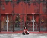 Activists from climate protest group This Is Rigged have daubed the UK Government office Queen Elizabeth House with red paint. Protestors scaled the office building with is off the Royal Mile with one apparently gluing herself to the pavement 