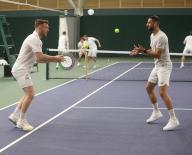 AFC Wimbledon team have a tennis lesson at the All England Club in Wimbledon from Annabel Croft L to R Alex Pearce and Omar Bugiel Monday 8th April 2024