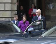 First Minister John Swinney leaves the Court of Session with wife Elizabeth and son Matthew after being sworn in by Lord Carloway, Lord President of the Court of Session