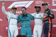 SUZUKA, JAPAN - OCTOBER 07: Lewis Hamilton, Mercedes AMG F1, 1st position, on the podium with Valtteri Bottas, Mercedes AMG F1, 2nd position, and Max Verstappen, Red Bull Racing RB14, 3rd position during the Japanese GP at Suzuka on October 07, 2018 in Suzuka, Japan. (Photo by Steve Etherington / LAT Images)