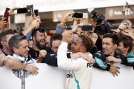 SUZUKA, JAPAN - OCTOBER 07: Lewis Hamilton, Mercedes AMG F1, 1st position, celebrates his win with his team during the Japanese GP at Suzuka on October 07, 2018 in Suzuka, Japan. (Photo by Steve Etherington / LAT Images)