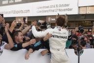 SUZUKA, JAPAN - OCTOBER 07: Lewis Hamilton, Mercedes AMG F1, 1st position, celebrates his win with his team during the Japanese GP at Suzuka on October 07, 2018 in Suzuka, Japan. (Photo by Steve Etherington / LAT Images)