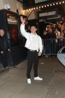Tom Holland waves to the huge crowd as he leaves the Duke of York