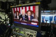 March 7, 2024 - Washington, DC, United States: United States President Joe Biden, center, is seen with United States Vice President Kamala Harris, left, and Speaker of the US House of Representatives Mike Johnson (Republican of Louisiana), right, on a television monitor in the James S. Brady Press Briefing Room of the White House, as he delivers his State of the Union address at the US Capitol in Washington, DC, Thursday, March 7, 2024. (Rod Lamkey / CNP / Polaris