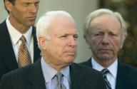 12/16/2005 - Washington, District of Columbia, United States of America: Washington, D.C. - December 16, 2005 -- United States Senator.John McCain (Republican of Arizona), center, answers questions at the White House in Washington, DC, following a briefing on the war in Iraq from United States President George W. Bush and Department of Defense (DoD) officials. Senator McCain was at the White House just a day after securing a landmark agreement on a bill that will formally ban the use of torture on detainees held by United States forces anywhere in the world. United States Senator John Thune (Republican of South Dakota), left, and United States Senator Joe Lieberman (Democrat of Connecticut), right, look on..(Ron Sachs / CNP / Polaris