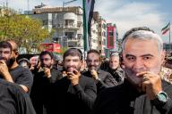 April 5, 2024 - Tehran, Iran: The attendees on the Quds day rally are wearing face masks of Major gen. Qassem Soleimani and 7 members of IRGC who were killed during an airstrike attack of Israeli forces on Iran