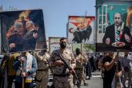 April 5, 2024 - Tehran, Iran: The basij forces are holding photoshopped and cartoon pictures of Biden and Netanyahu during the annual Quds day rally. Thousands of people chanted against Israel and the United States at today