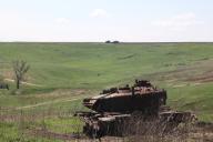 KHARKIV REGION, UKRAINE - APRIL 20, 2024 - A destroyed military vehicle is seen in the field of Start LLC, an agricultural enterprise, during the sowing campaign, Kharkiv region, northeastern Ukraine. (Ukrinform/POLARIS