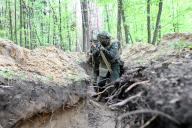 ZHYTOMYR REGION, UKRAINE - APRIL 23, 2024 - Soldiers practise clearing a trench from the enemy in pairs during the drills of the Liut (Fury) Brigade of the National Police of Ukraine at a training area in Zhytomyr region, northern Ukraine. (Ukrinform\/POLARIS
