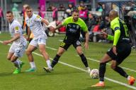 KYIV, UKRAINE - APRIL 21, 2024 - Players of FC Dynamo Kyiv (white kit) and FC Polissya Zhytomyr (black and green kit) are seen in action during the Ukrainian Premier League Matchday 25 game at the Valeriy Lobanovskyi Dynamo Stadium, Kyiv, where the hosts secured a 3-0 win. (Ukrinform\/POLARIS