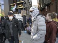 April 24, 2024 - Boston, Massachusetts, United States: Emerson College students and non Emerson students protesting Israelâs war in Gaza. Students blocking an alley that connects to several Emerson College buildings and the Massachusetts Transportation Building. The alley is a public walkway. (Rick Friedman \/Polaris
