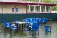 KYIV, UKRAINE - APRIL 24, 2024 - Tables and chairs at an outdoor cafe are flooded in Hidropark, a recreational park, due to rising water levels in the Dnipro River, Kyiv, capital of Ukraine. (Ukrinform\/POLARIS