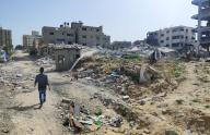 April 24, 2024 - Gaza: Palestinians walk past the rubble of residential buildings destroyed by Israeli strikes, amid the ongoing Israel war on Gaza. (Khaled Daoud\/APAImages\/Polaris