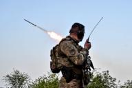ZAPORIZHZHIA REGION, UKRAINE - APRIL 27, 2024 - A serviceman of the Steppe Wolves all-volunteer unit stands near a pickup equipped with Grad rocket launch tubes captured from Russian troops and a sighting device on a combat mission, Zaporizhzhia Region, southeastern Ukraine. (Ukrinform\/POLARIS