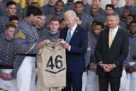4\/5\/2024 - Washington, District of Columbia, United States of America: United States President Joe Biden receives a team jersey by team captain Jimmy Ciarlo, left, as head coach Jeff Monken, right, during the ceremony presenting the Commander-in-Chiefâs Trophy to the United States Military Academy Army Black Knights at the White House in Washington, DC, May 6, 2024. (Chris Kleponis \/ CNP \/ Polaris