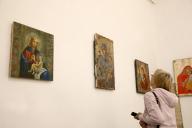 KYIV, UKRAINE - MAY 9, 2024 - A woman looks at artworks displayed at the Icons on Ammo Boxes exhibition in the Great Lavra Bell Tower of the Kyiv-Pechersk Lavra, Kyiv, capital of Ukraine. (Ukrinform/POLARIS