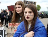 KYIV, UKRAINE - MAY 12, 2024 - A participant has an inscription "Free Azov" on her face during the action in support of the captured defenders of Mariupol "Donât be silent! Captivity Kills" on Obolonska embankment, Kyiv, capital of Ukraine. (UKRINFORM/POLARIS